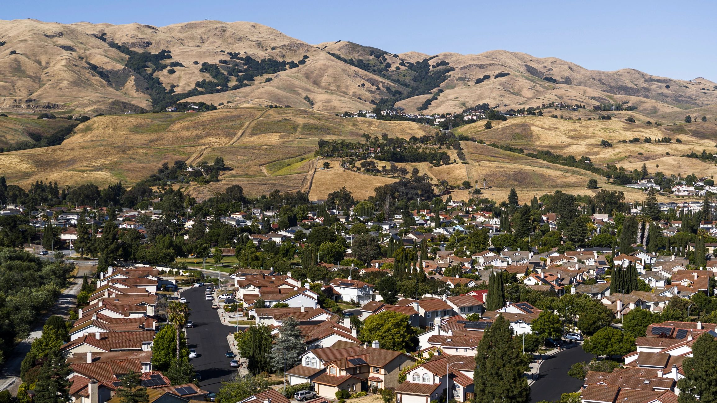 Aerial view of a small town neighborhood representing the Peaceful Village community