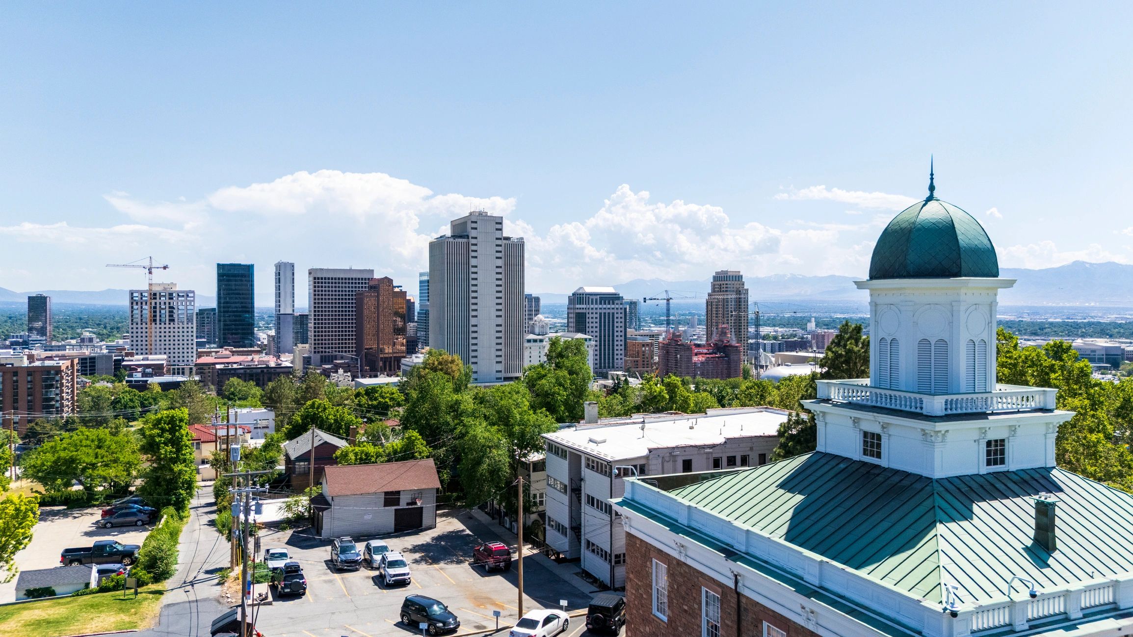 Civic building and downtown skyline symbolizing local government service